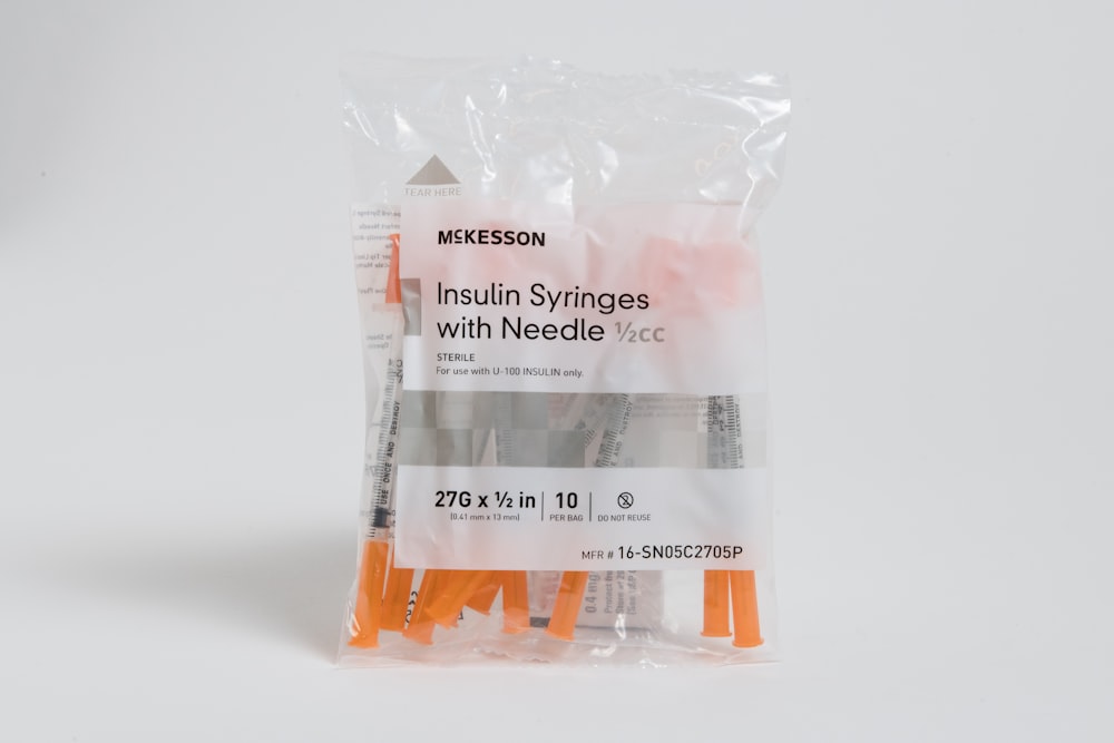 a package of needles with needles inside of it