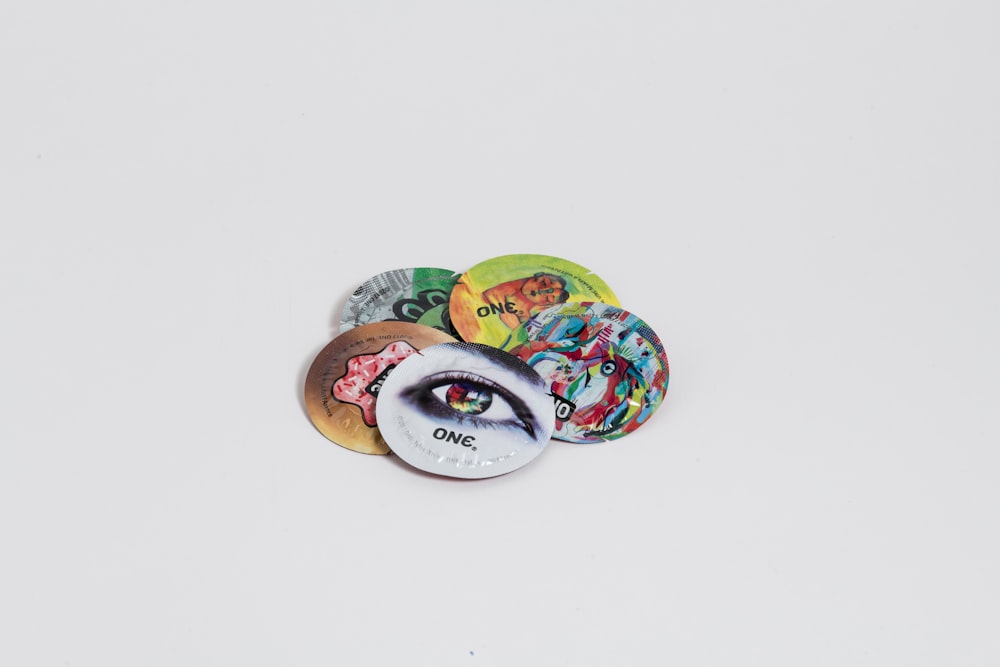 a pile of buttons with a picture of a person's eye