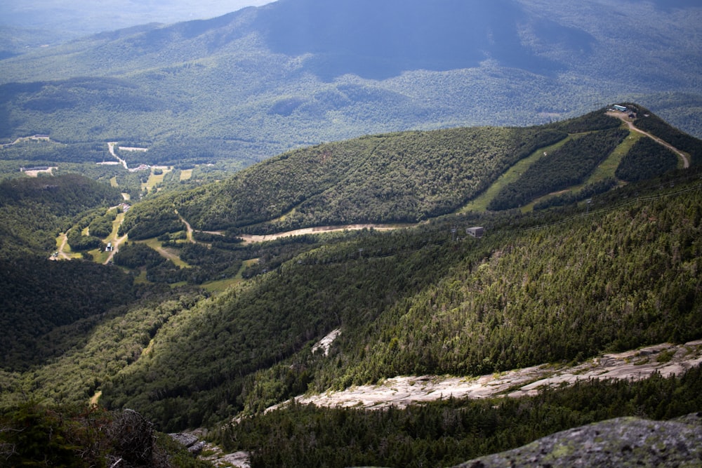 a scenic view of a valley and mountains