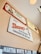 Several vintage-style advertisement signs are displayed on a wall. The signs feature brands such as Rudy's Farm Country Sausage, Elm Hill Meats, Shoney's Big Boy Restaurants, and Martha White Flour. Each sign has a retro design with unique fonts and illustrations, giving a nostalgic vibe.