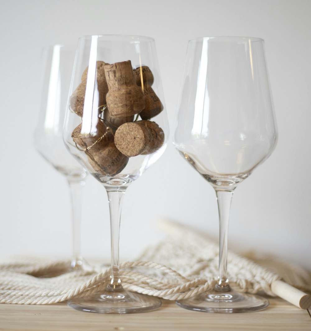 a couple of wine glasses sitting on top of a table