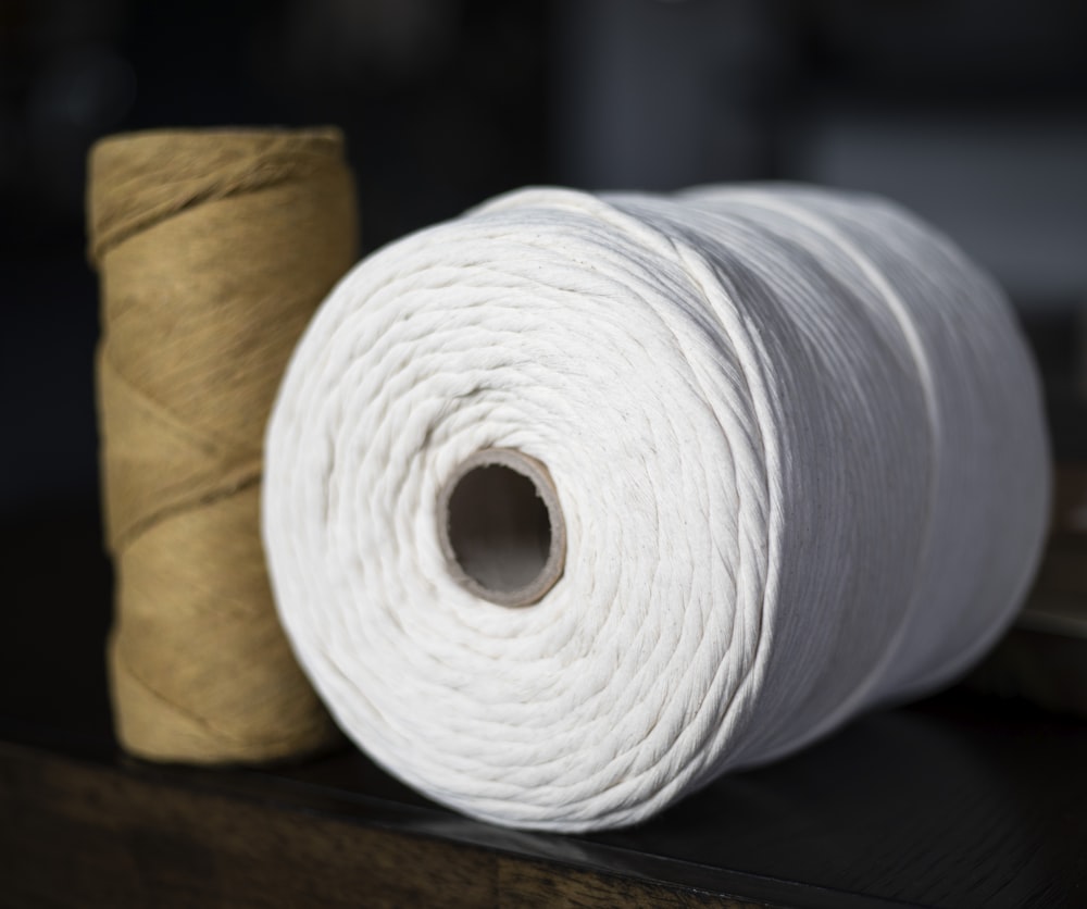 two skeins of yarn sitting on a table