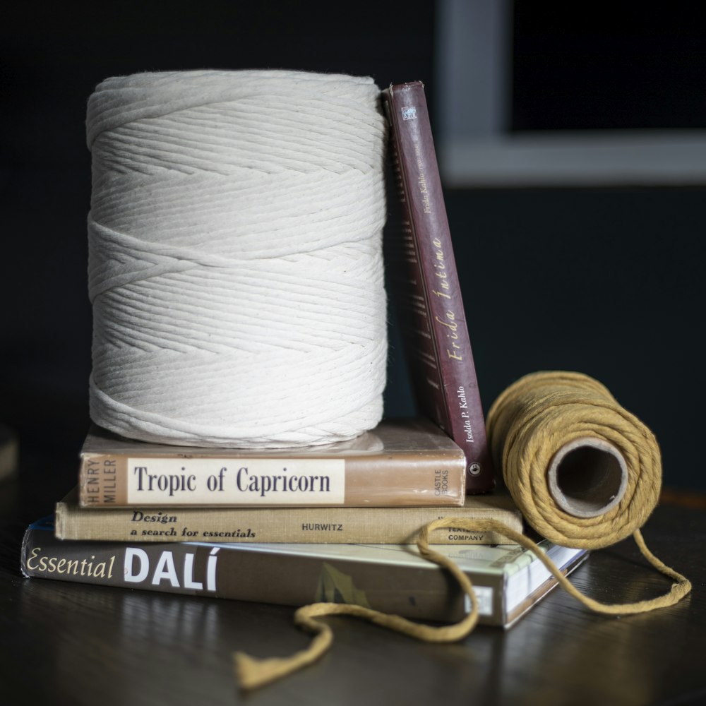 a couple of books and some yarn on a table