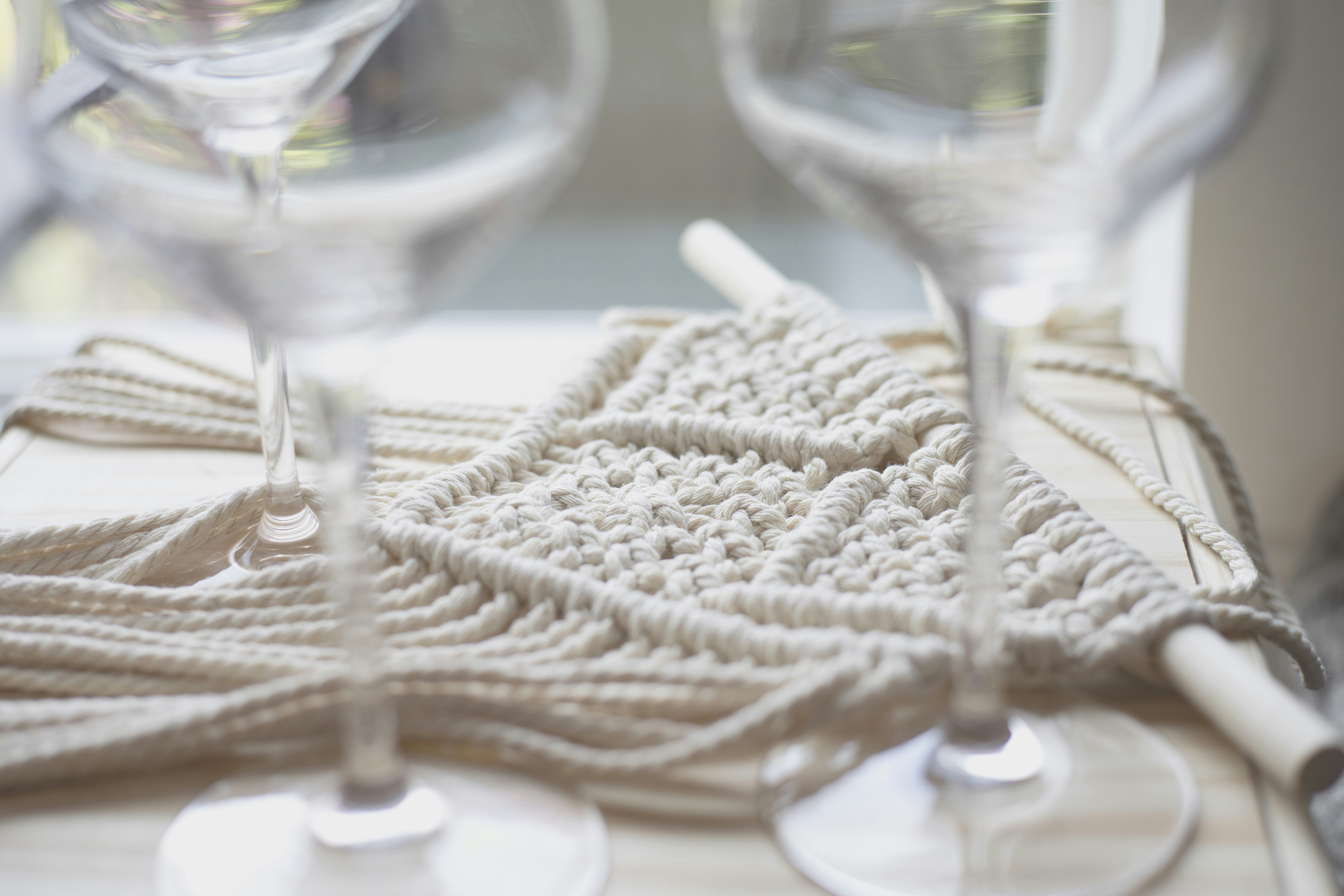 Chunky yarn and crochet hooks on a table