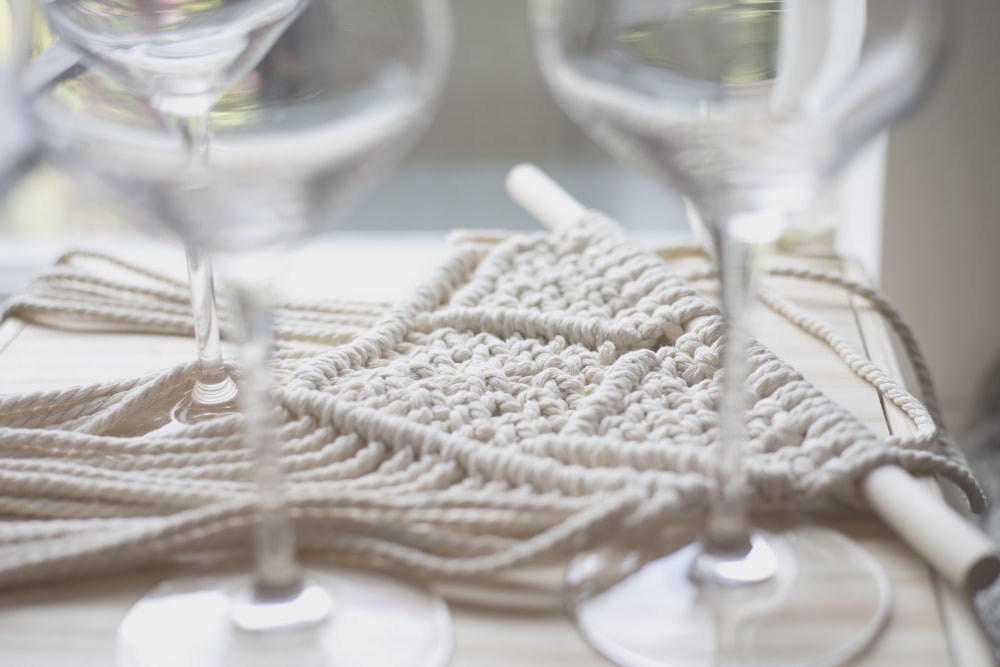 a close up of wine glasses on a table