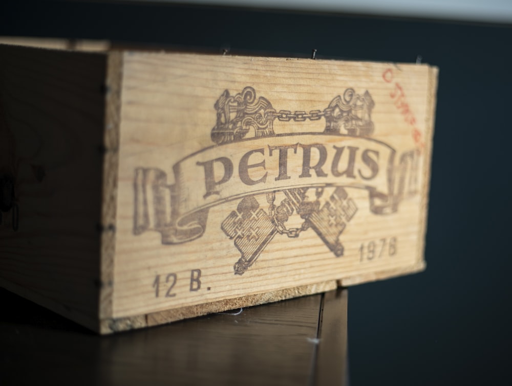 a close up of a wooden box on a table