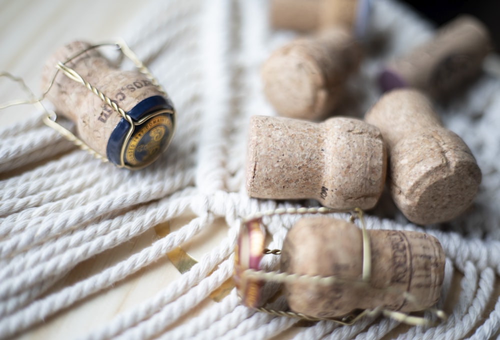 a group of wine corks sitting on top of a white rope