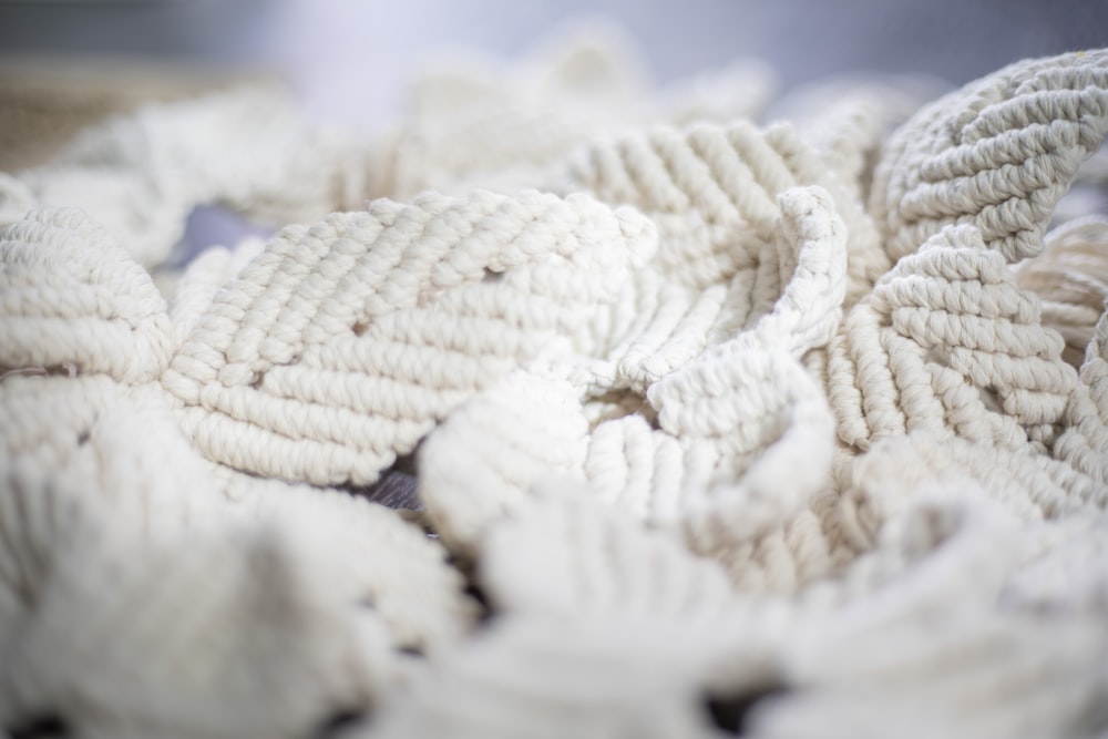 a pile of white rope sitting on top of a table