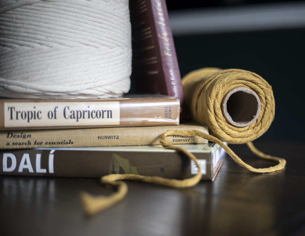 a couple of books sitting on top of a table