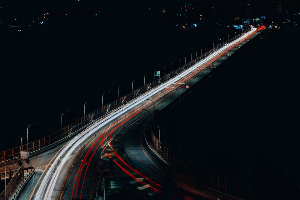 a long exposure shot of a highway at night