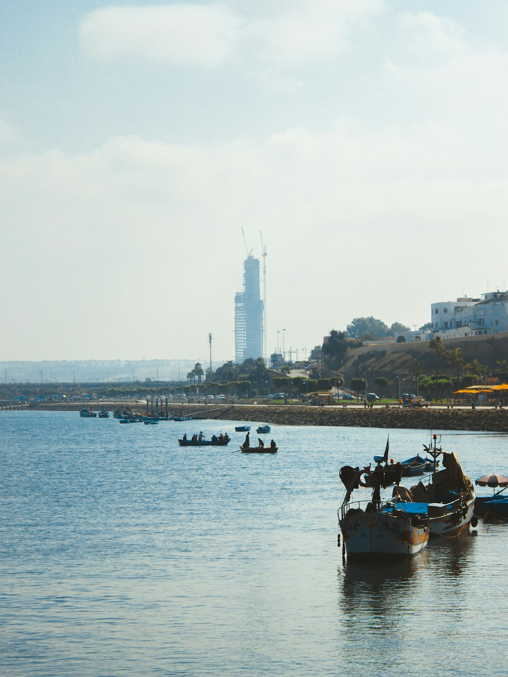 a group of boats floating on top of a body of water