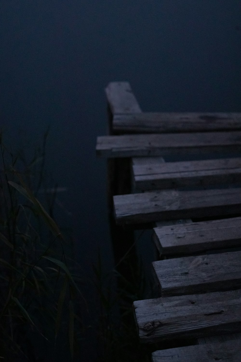 a bench sitting next to a body of water