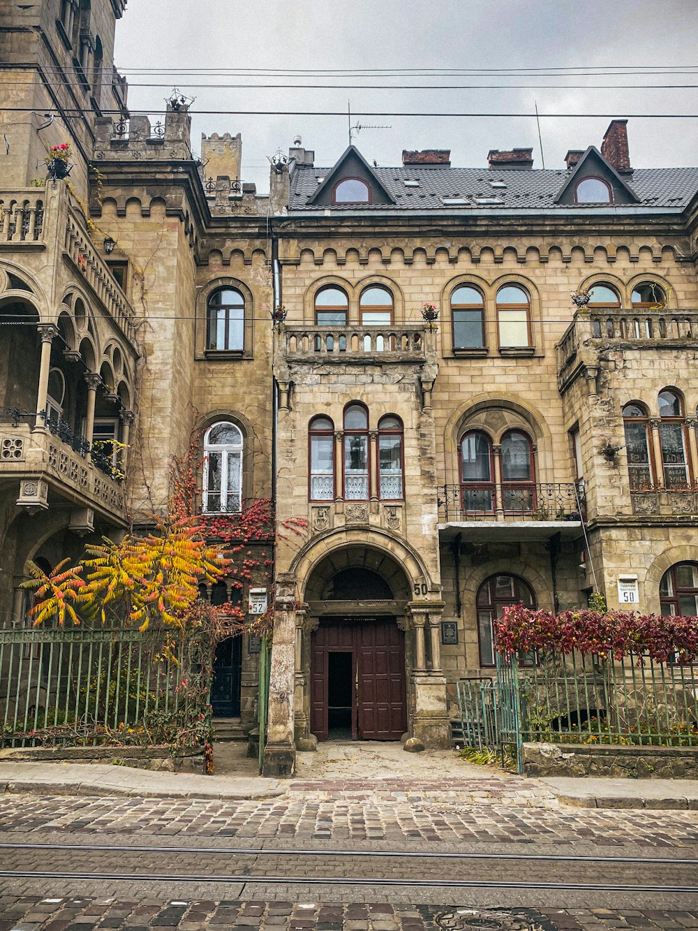 an old building with a gate in front of it