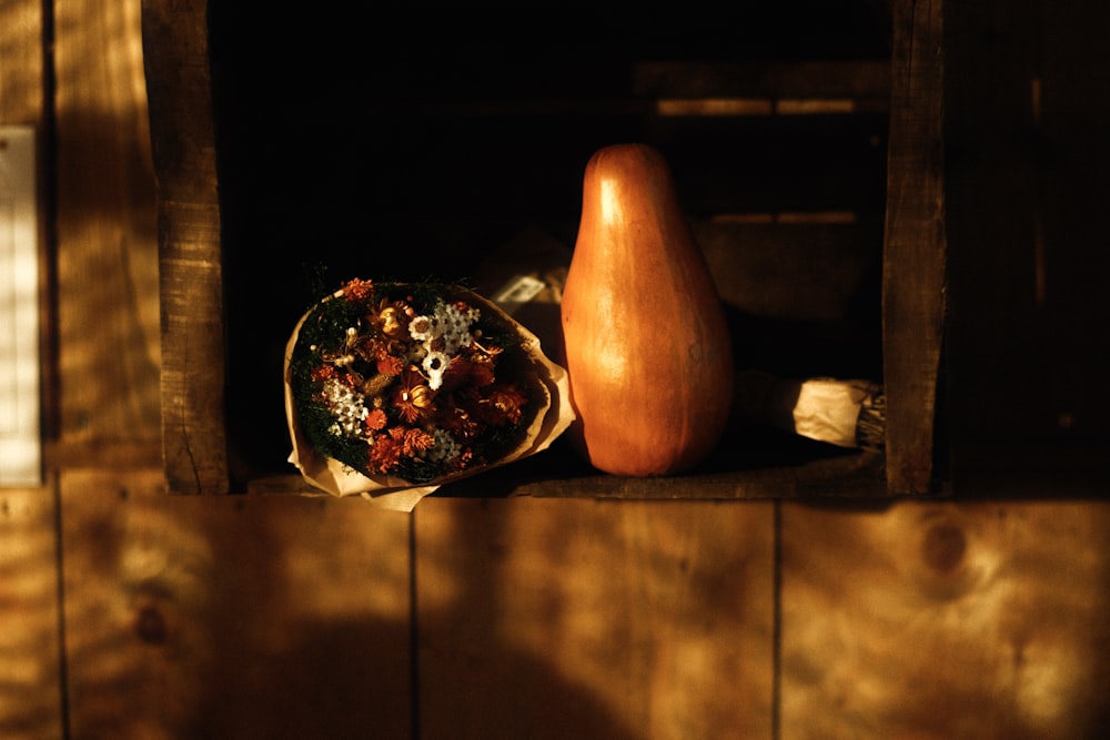 a pear and a bag of dried fruit on a shelf