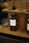 a couple of bottles of alcohol sitting on a shelf