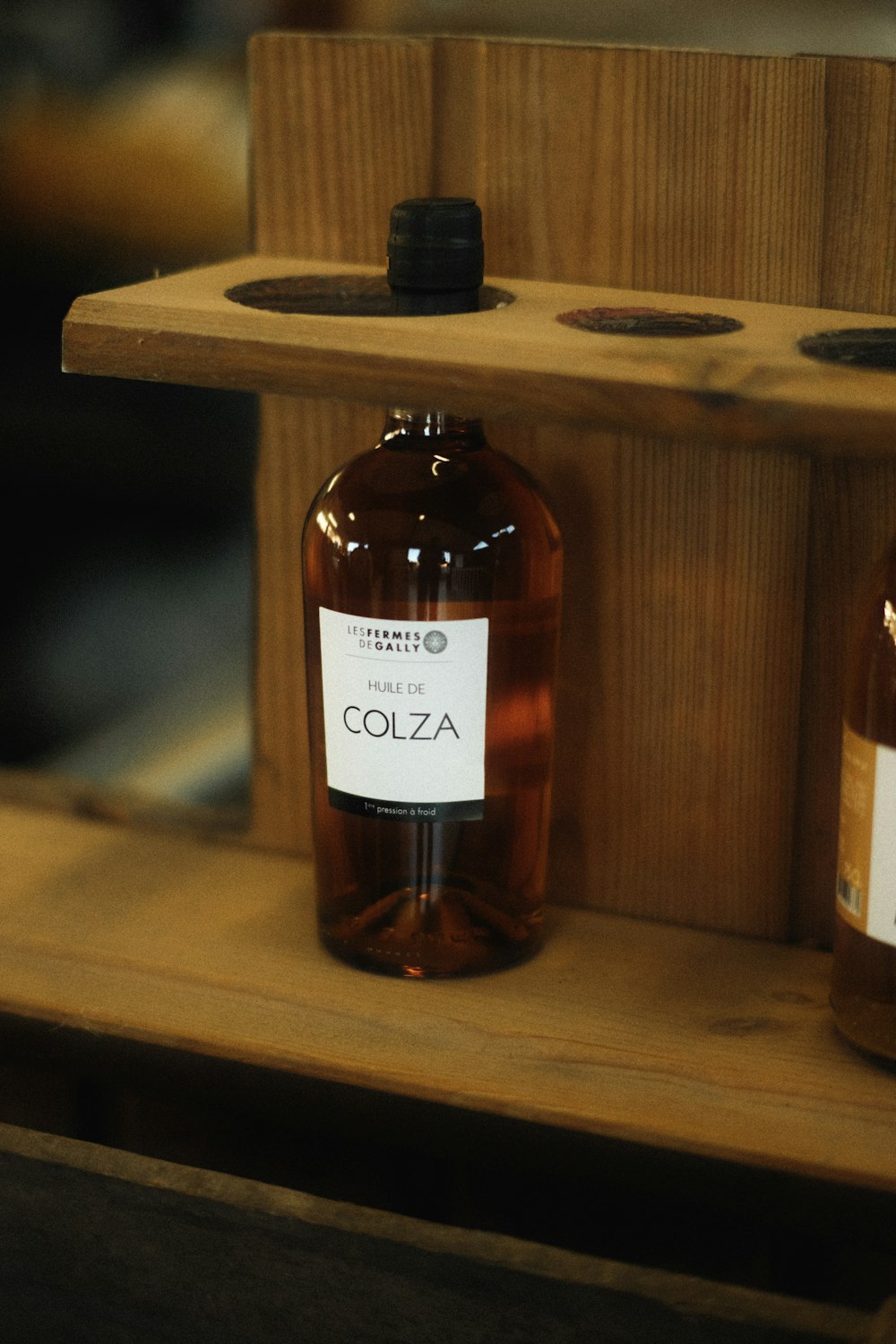 a couple of bottles of alcohol sitting on a shelf