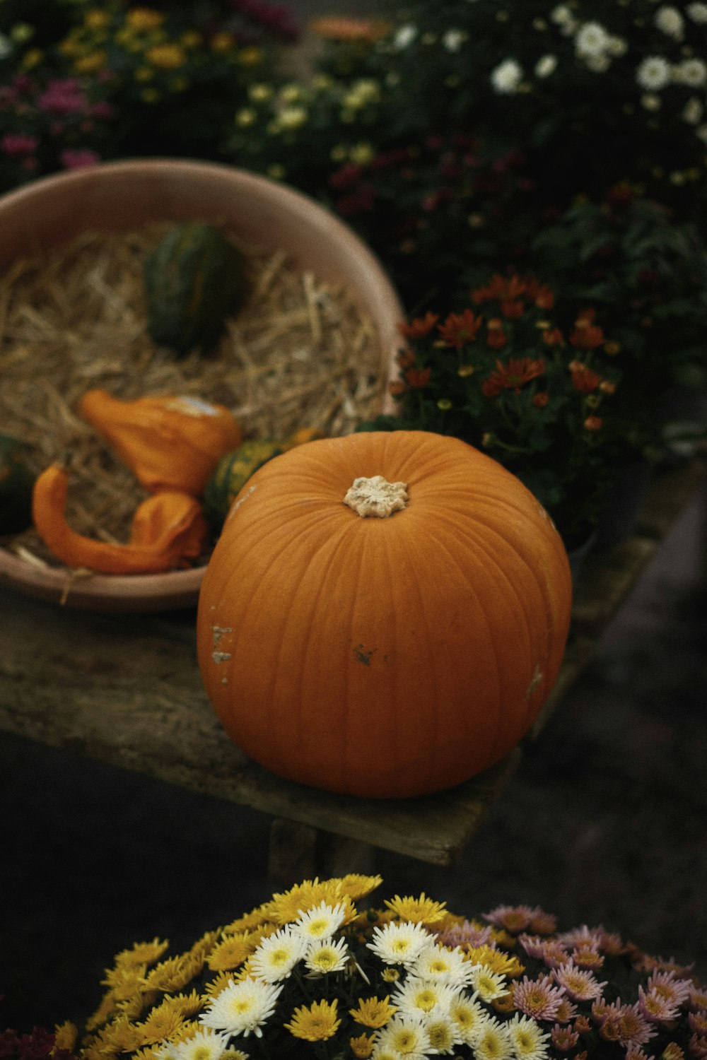 a pumpkin sitting on top of a wooden table