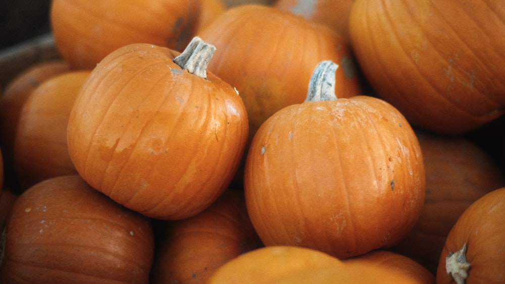 a pile of pumpkins sitting on top of each other