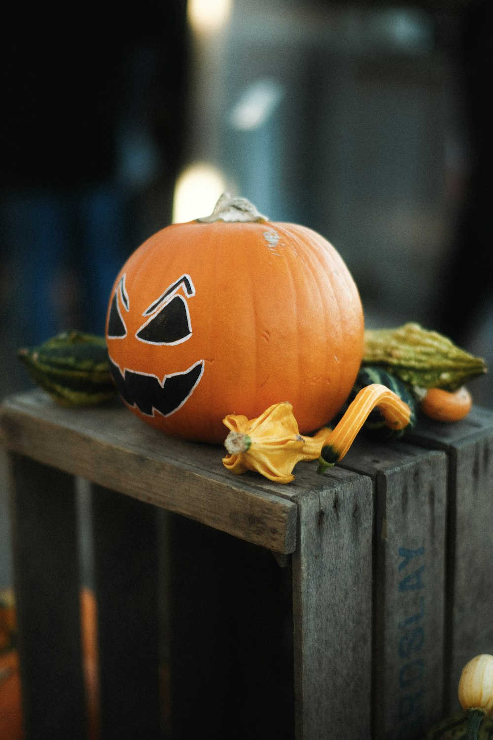 a pumpkin sitting on top of a wooden crate