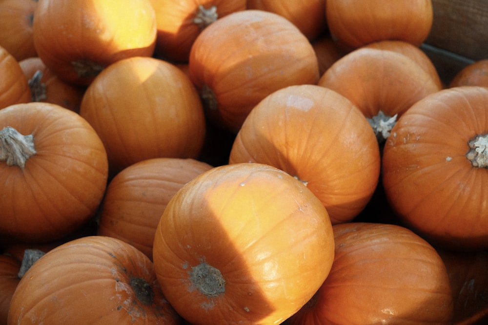 a pile of pumpkins sitting on top of a table