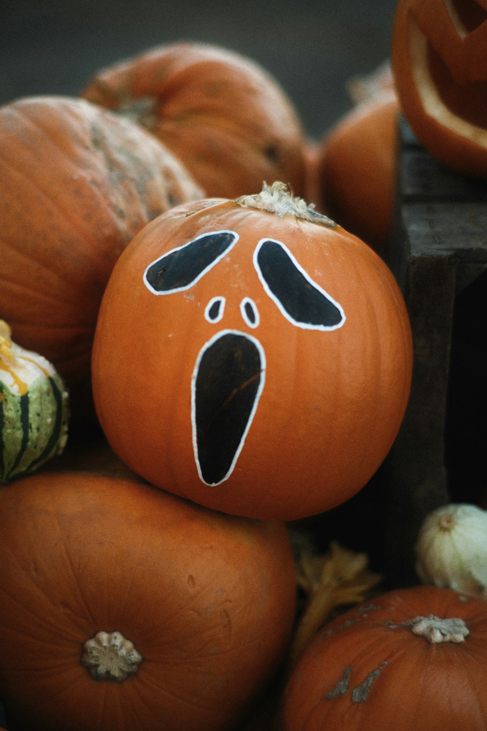 a group of pumpkins with faces painted on them