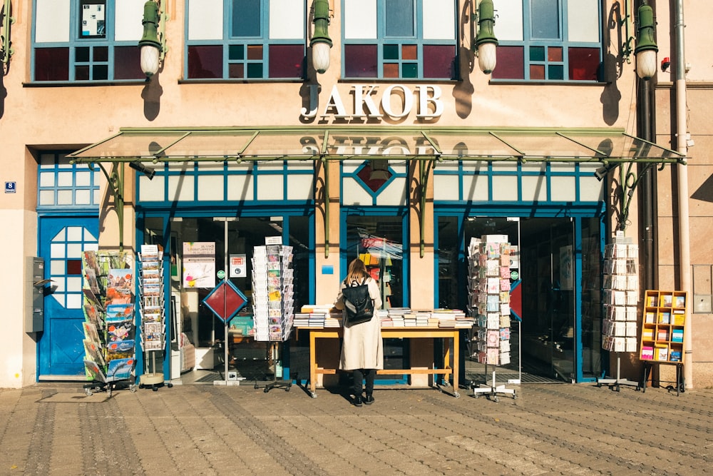 a man standing in front of a store