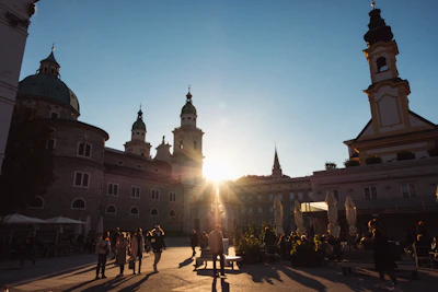 Sunset over a lively Salta village square filled with people enjoying music and dancing.