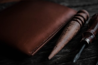 a pen and a wallet sitting on a table