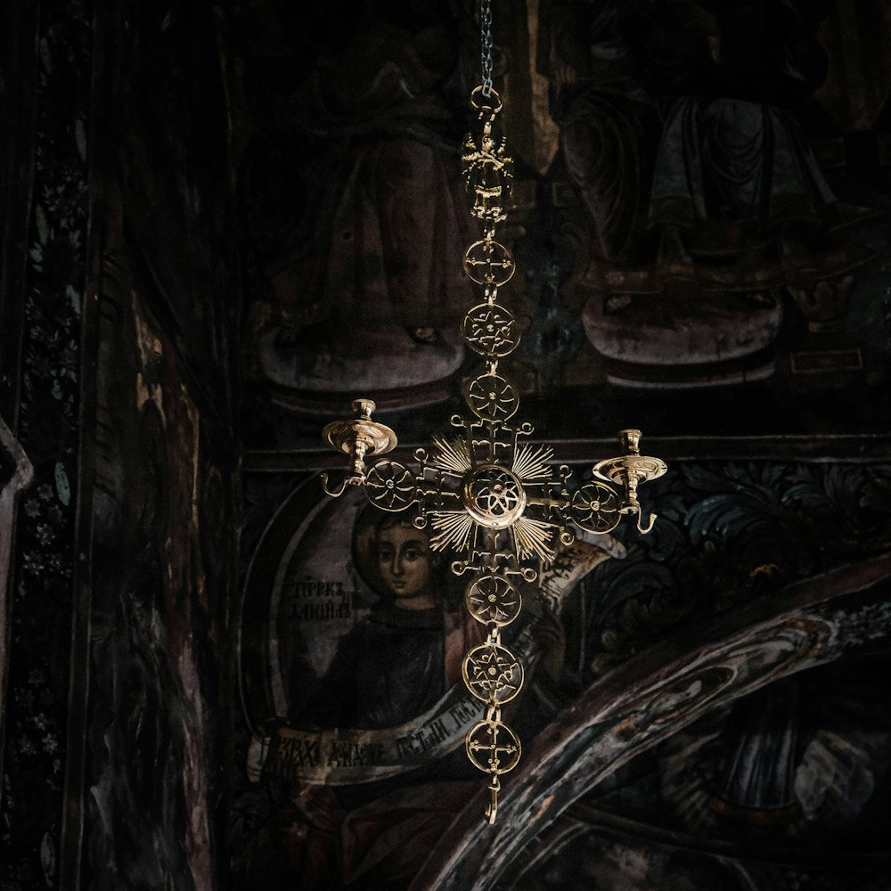 a cross hanging from the ceiling of a church