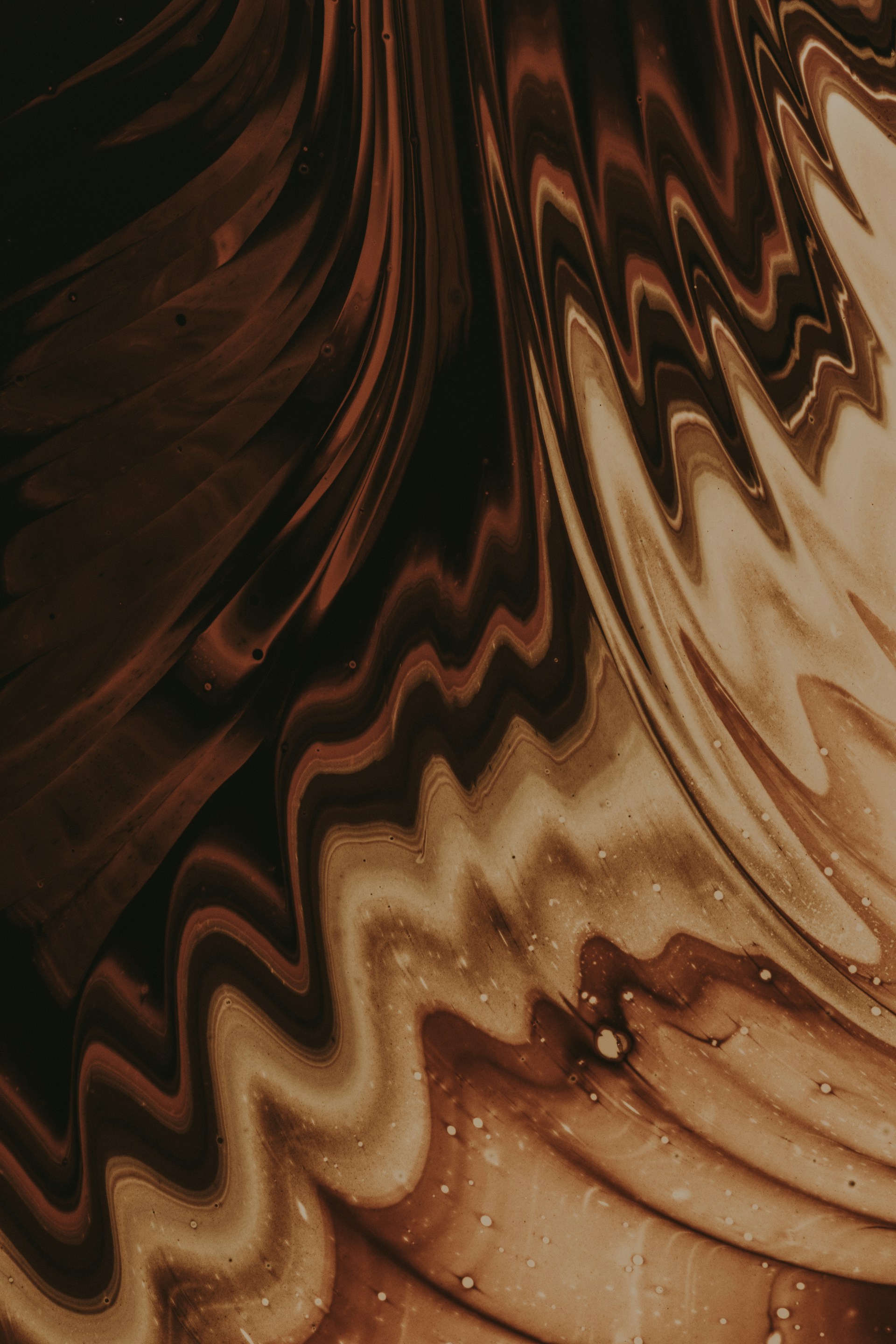 a close up of a brown and white swirl