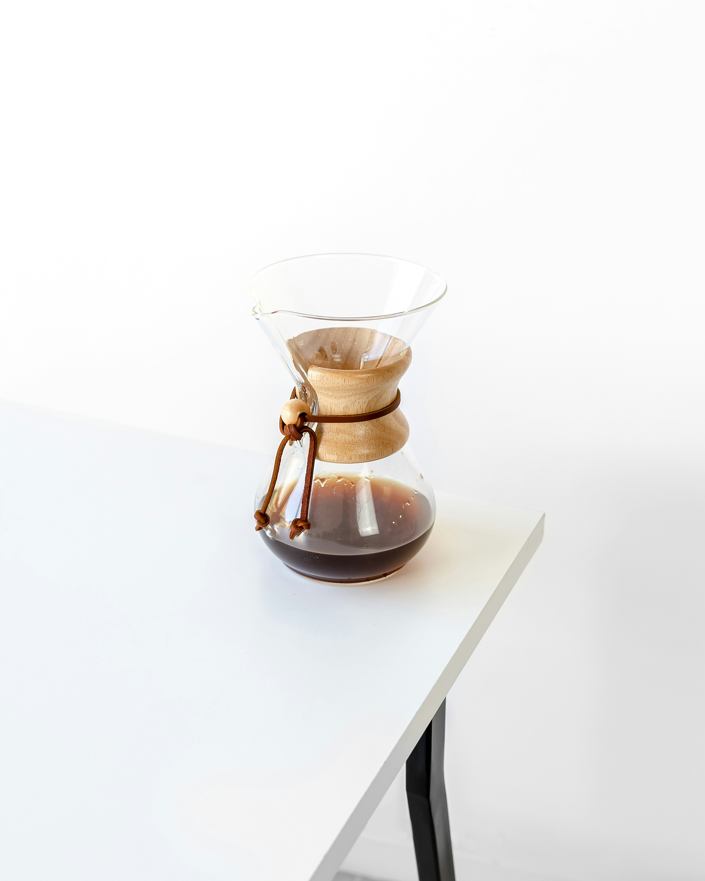 a coffee pot sitting on top of a white table