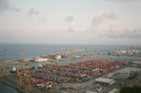 An aerial view of a shipping port with cargo vessels.