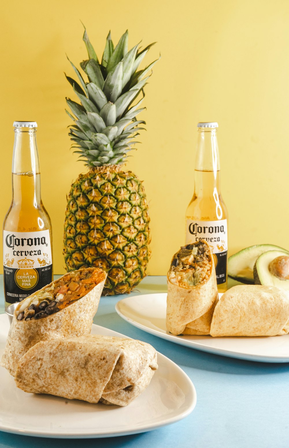 a plate of food and a pineapple on a table