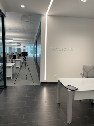 a room with a desk and a camera in it