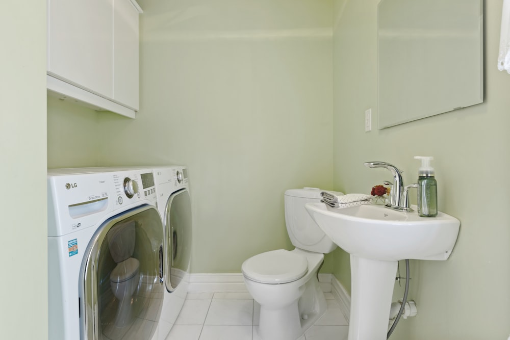 a washer and dryer in a small bathroom