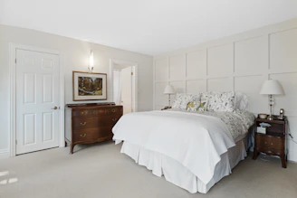 A cozy bedroom featuring a stylish bed and matching nightstands from Casanova.