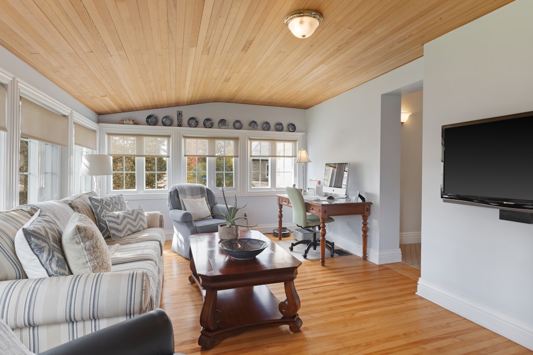 a living room filled with furniture and a flat screen tv,
