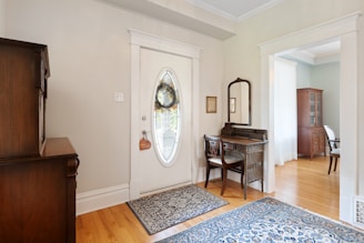 a living room with a piano and a mirror