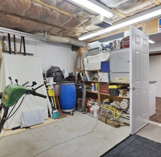 a garage filled with lots of clutter and tools