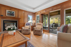 a living room filled with furniture and a fire place