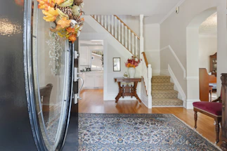 A welcoming home entryway with fresh air flowing, symbolizing clean, odor-free living.