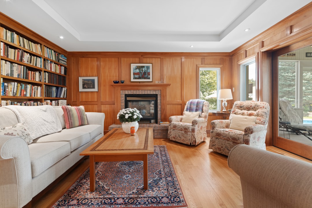 a living room filled with furniture and a fire place,