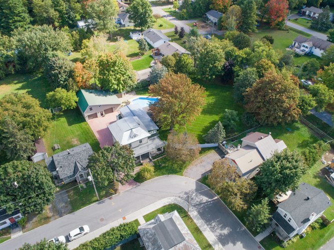 Aerial view of a suburban neighborhood with rows of houses