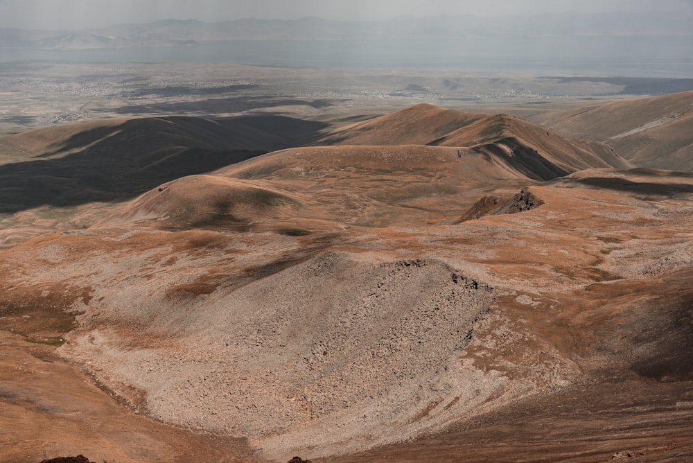 an aerial view of a mountain range in the desert