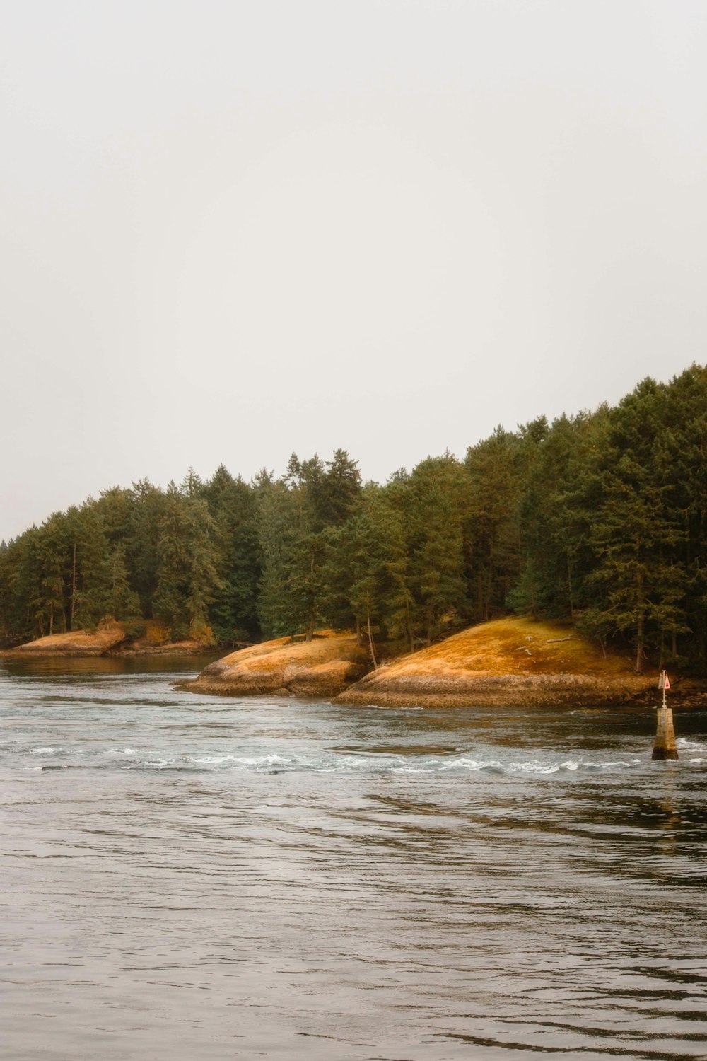 a body of water with a person standing in it