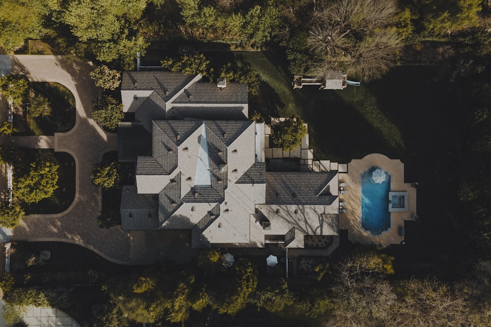 an aerial view of a house in the woods