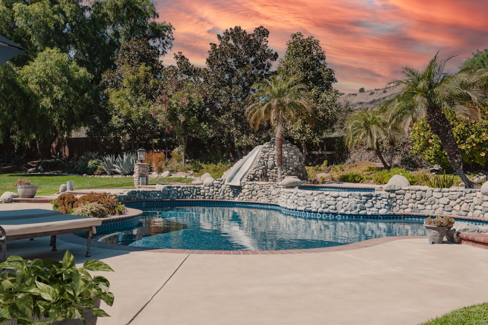 a pool with a slide in the middle of it