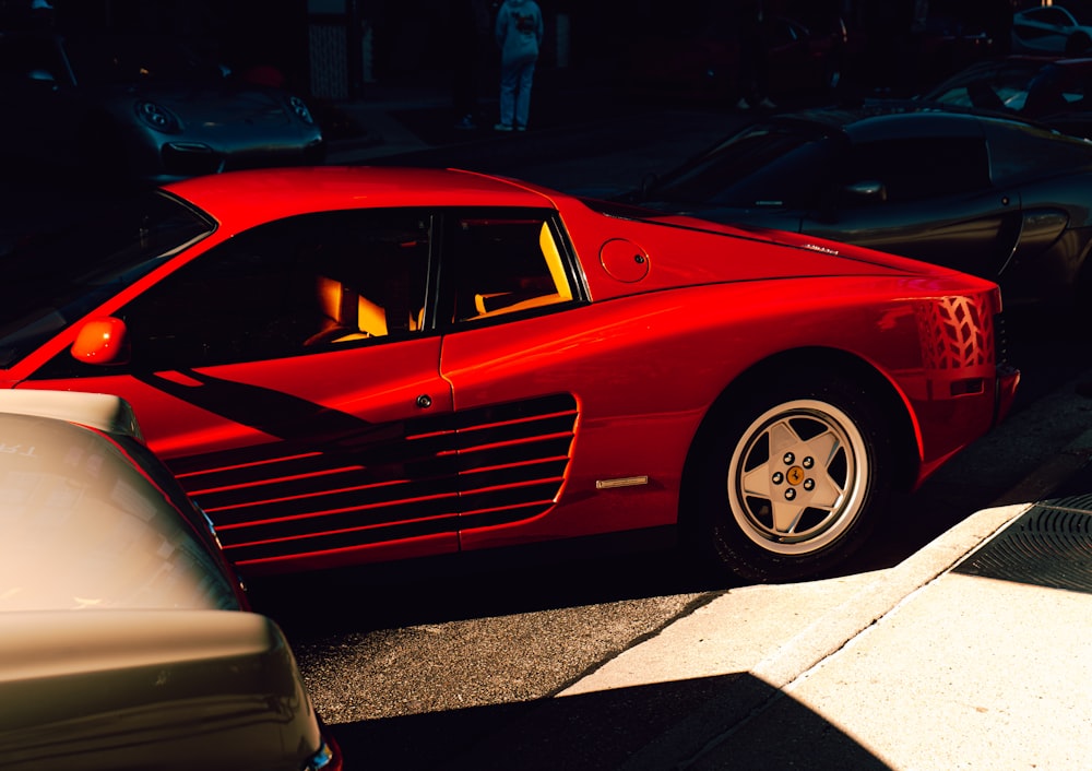 a red sports car parked in a parking lot