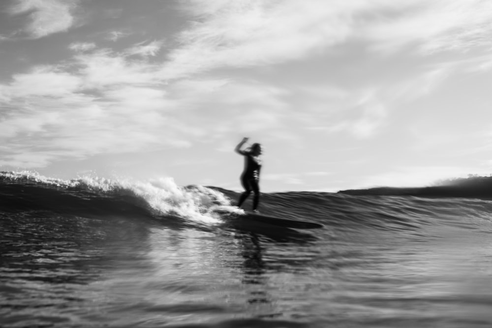 a person riding a surfboard on a wave in the ocean