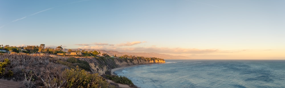 a scenic view of the ocean and a beach